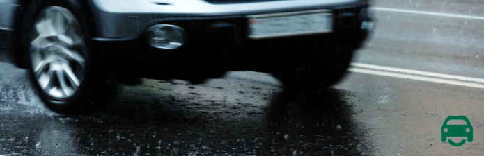 Car driving in rain with winter tyres